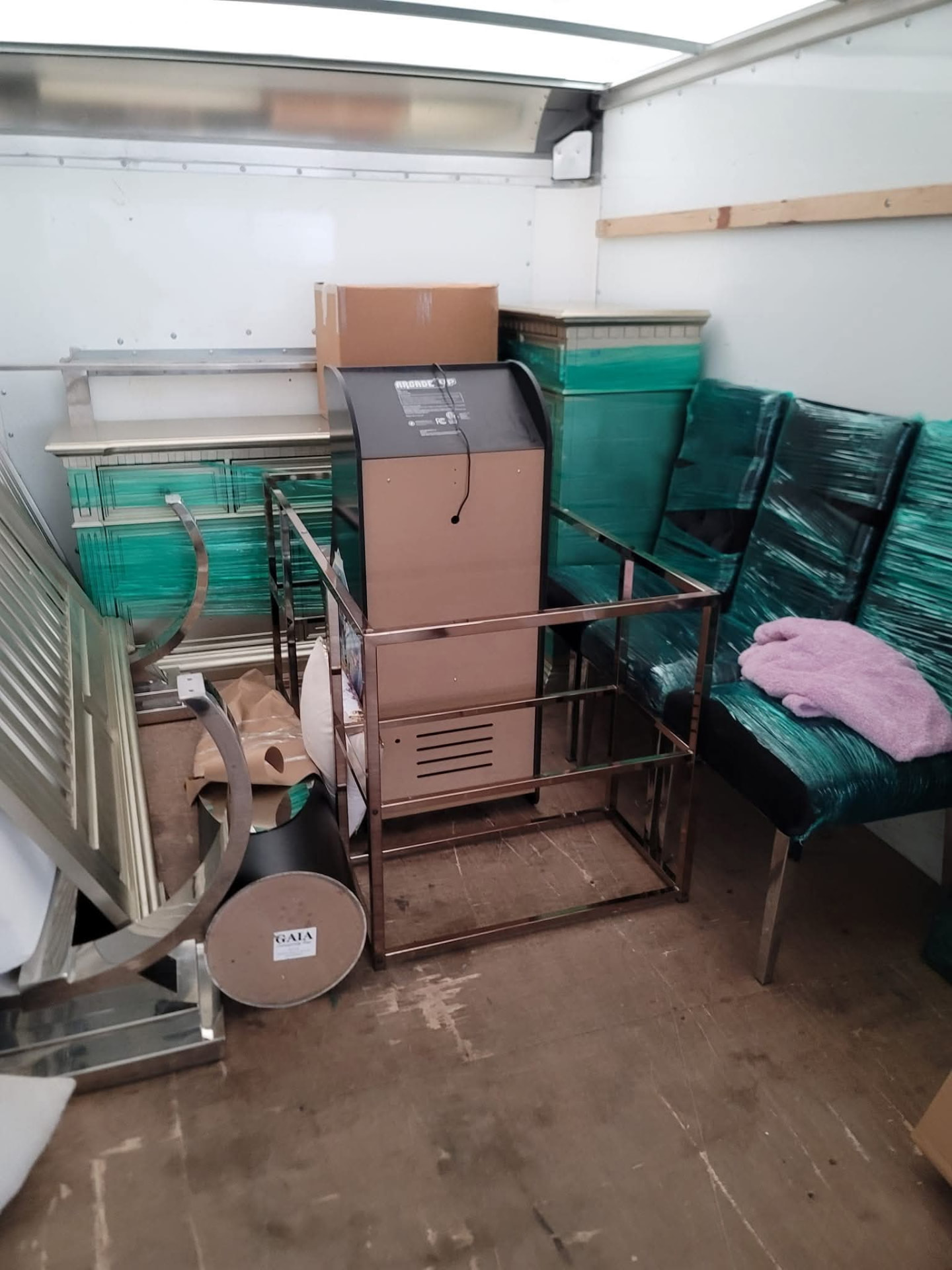 Protected glass furniture loaded securely in the moving truck