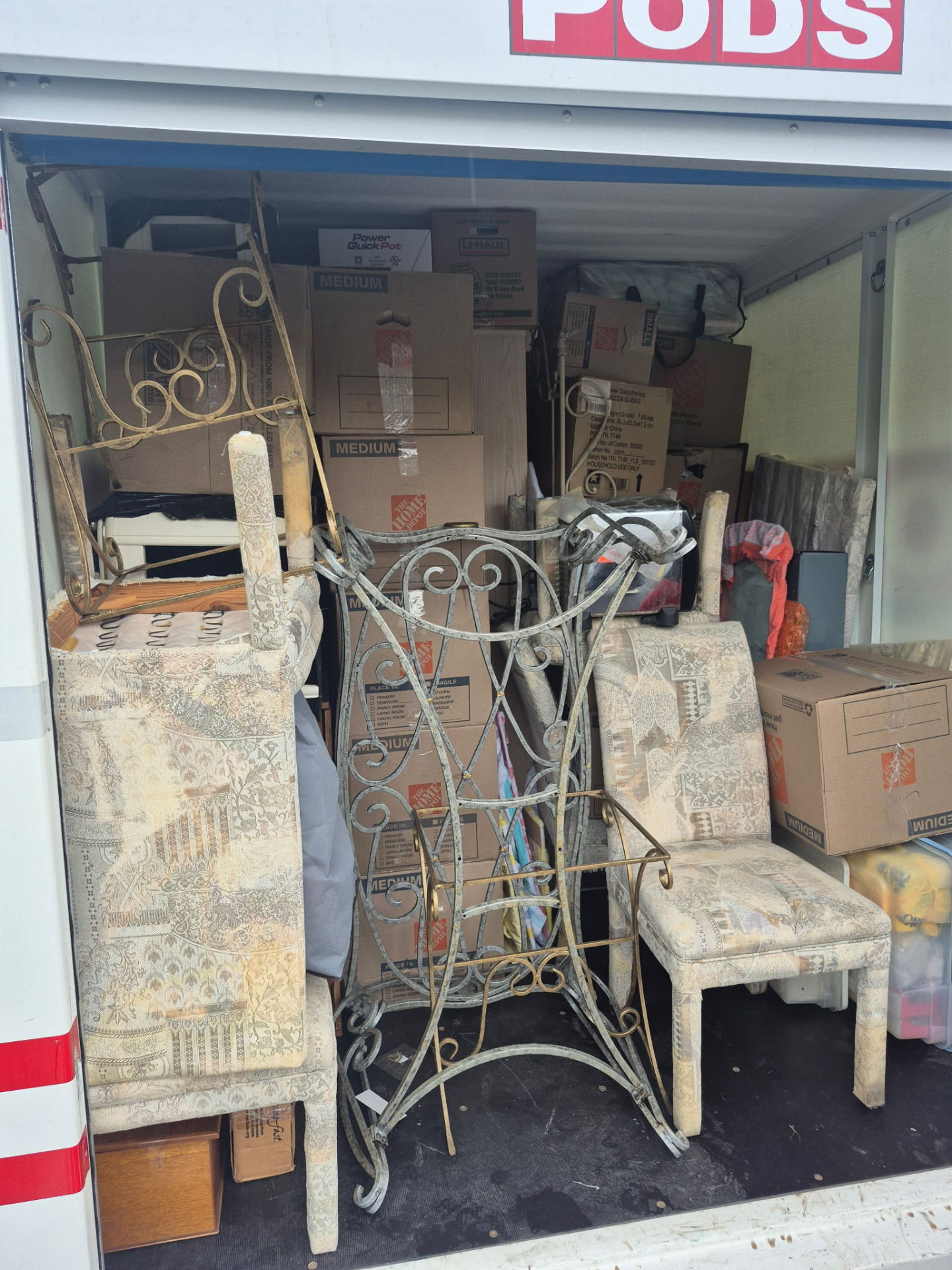 PODS container packed tight with boxes and furniture by Major Movers
